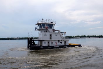 M/V Ashley Anne pushboat powered by twin Mitsubishi S6R2 Tier 3 engines underway on inland waterway.