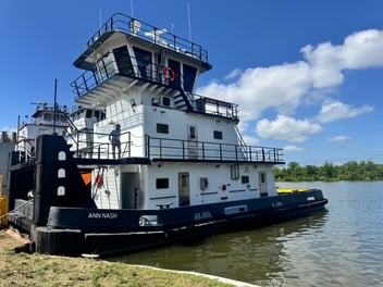 The M/V Ann Nash docked at a shipyard.