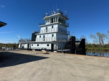 M/V Donny Mudgett towboat docked at Intracoastal Iron Works shipyard, powered by Mitsubishi marine engines supplied by Laborde Products.