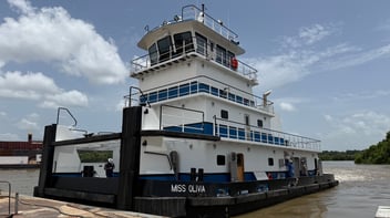 The newly built M/V Miss Olivia towboat at the dock, powered by three Mitsubishi S6R2 Tier 3 marine engines supplied by Laborde Products.