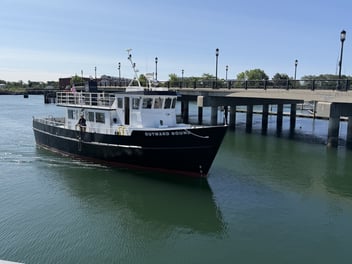 The M/V Outward Bound docked at a pier.