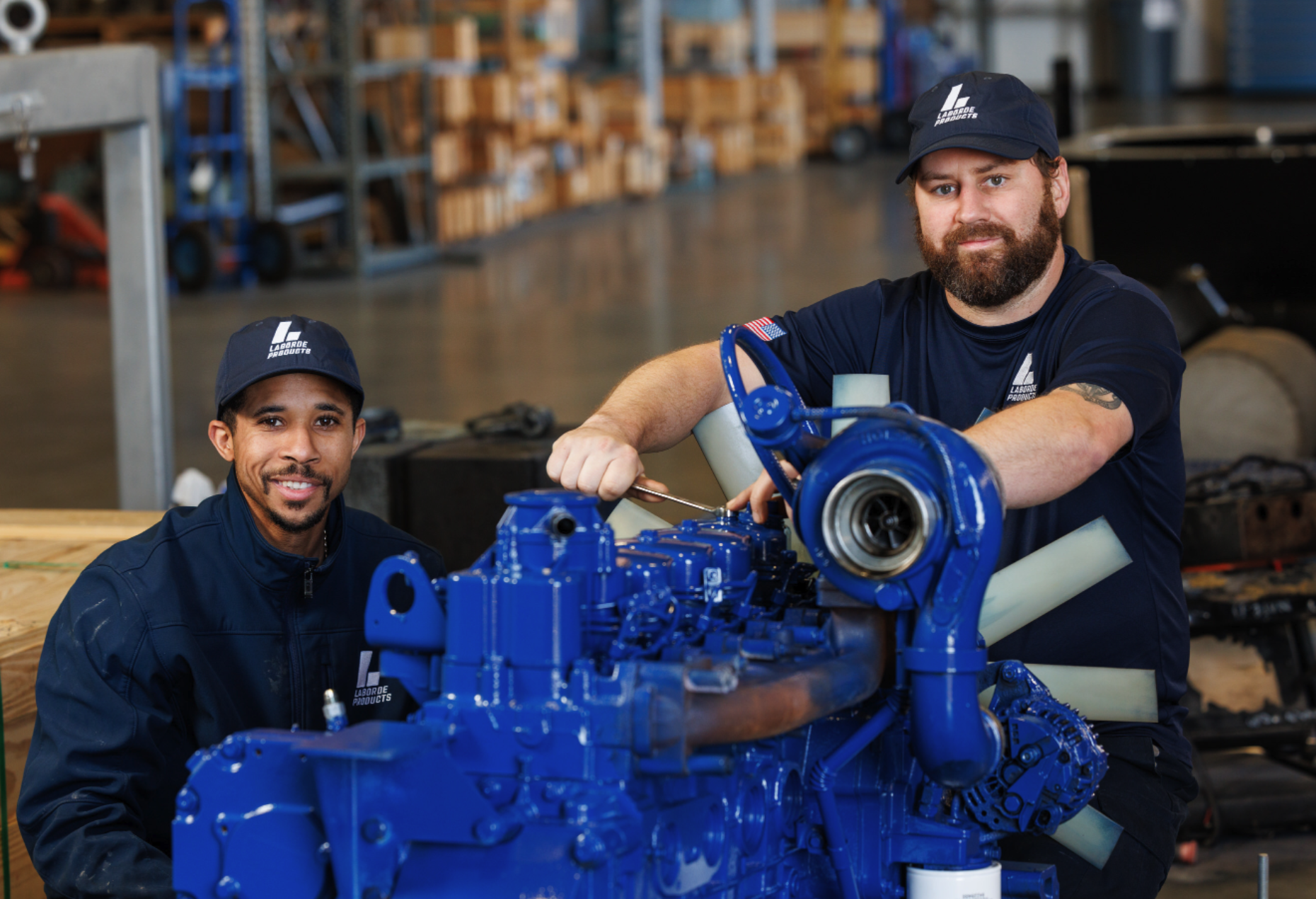 Technicians working on a marine genset for parts supply and service support