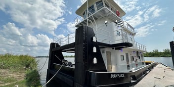 The M/V Joan Pluck, a newly built inland towboat by FMT Shipyard, docked and ready for service with twin Mitsubishi Tier 3 engines supplied by Laborde Products.