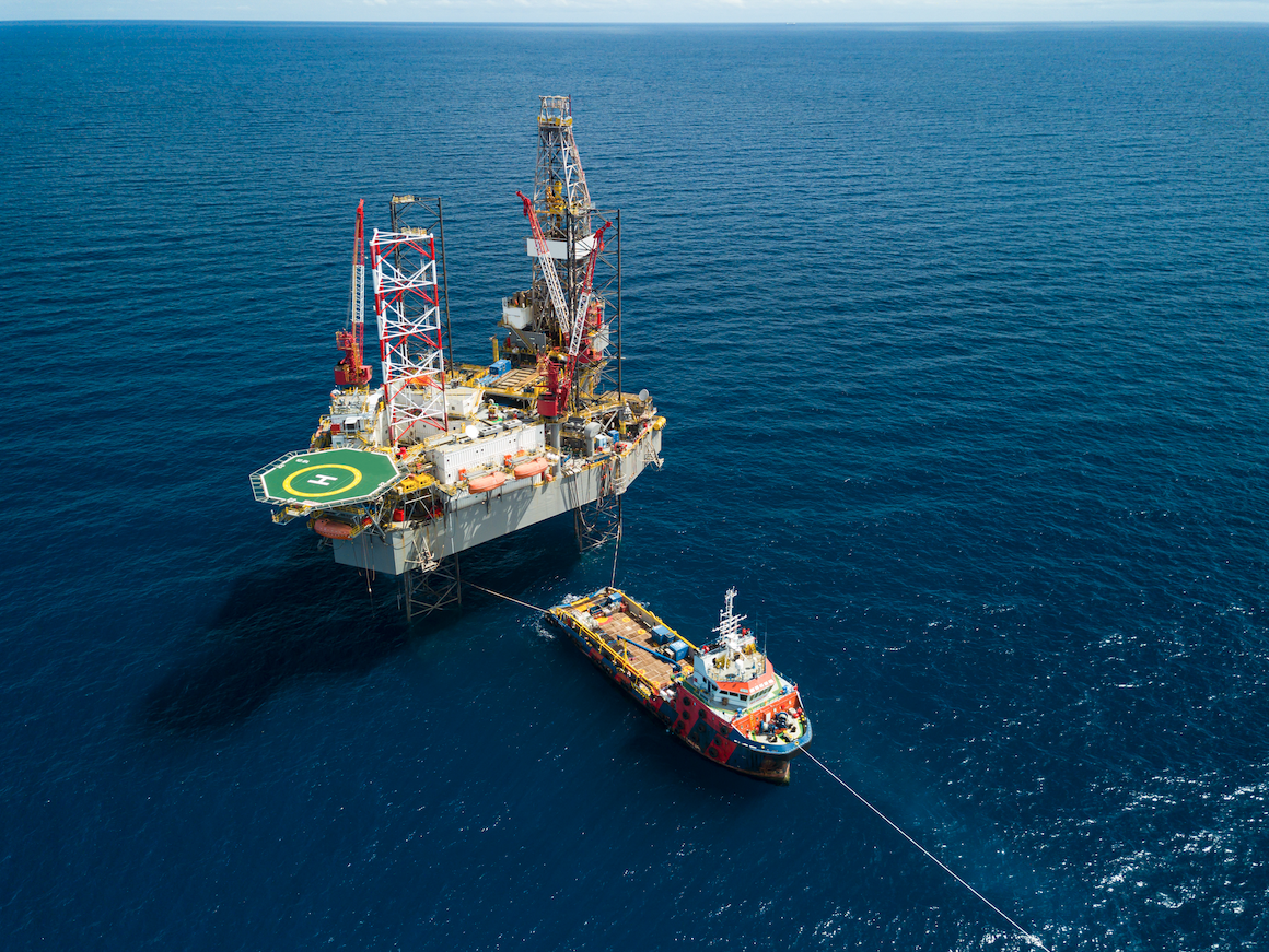 Offshore drilling platform supported by supply vessel in open water
